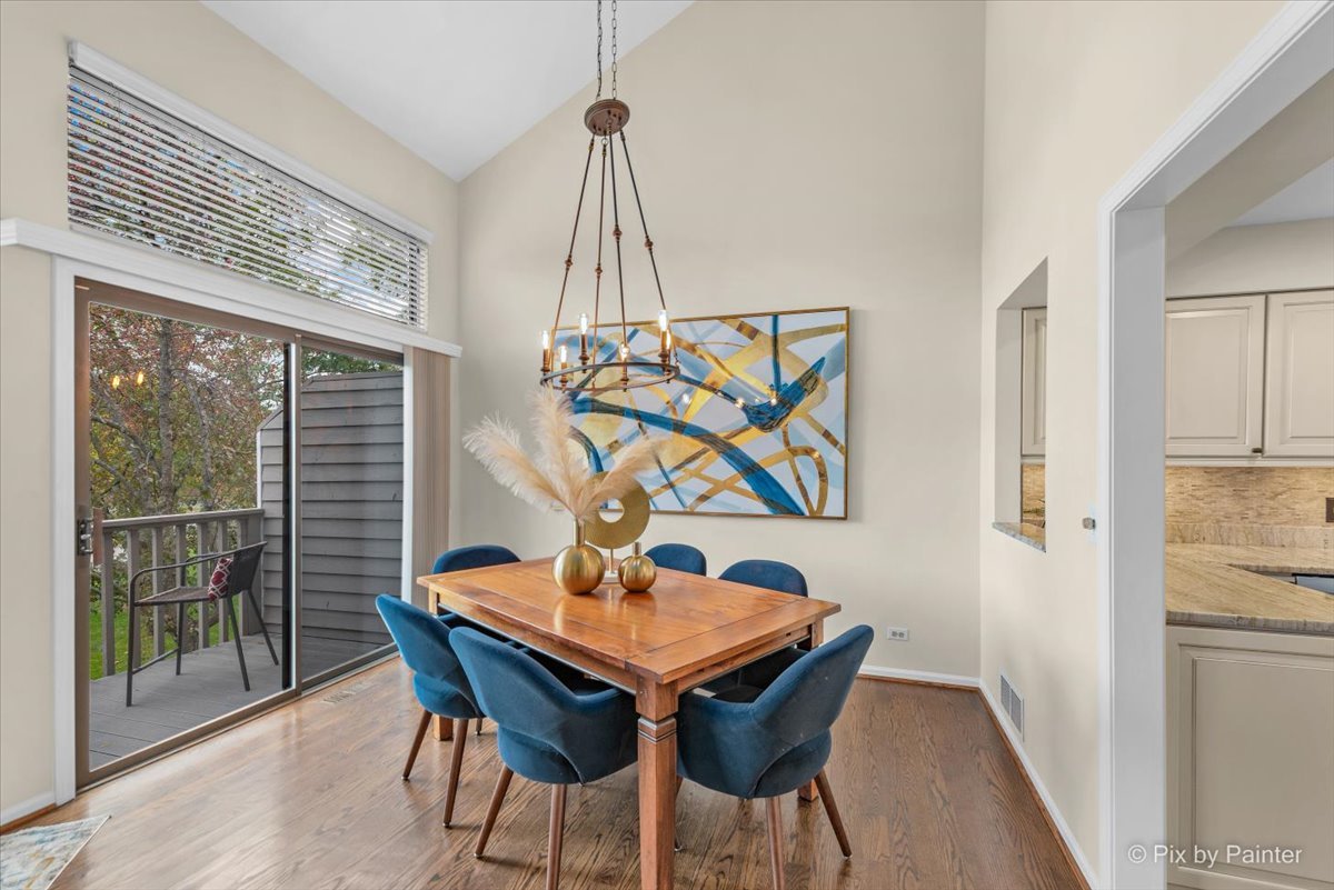 831 Shoreline Road Lake Barrington, IL 60010 - Photo 8 of 47 a view of a dining room with furniture window and wooden floor