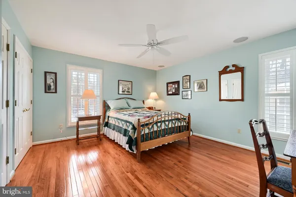 a bedroom with a bed and a desk