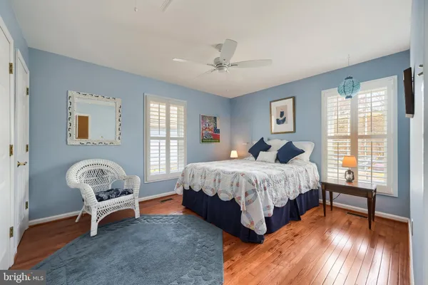 a spacious bedroom with a bed and a window