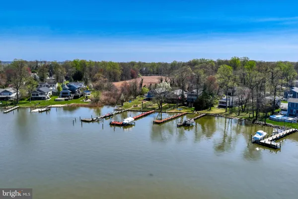 an aerial view of house with a yard