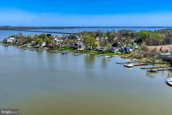 a view of a terrace with furniture and a mountain view