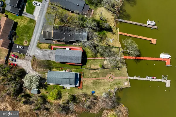 a aerial view of a house with a yard