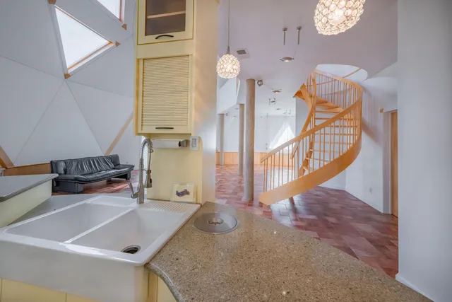 a bathroom with a sink a mirror and shower