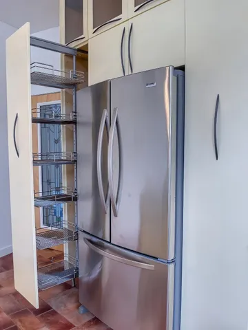 a view of a hallway with stairs