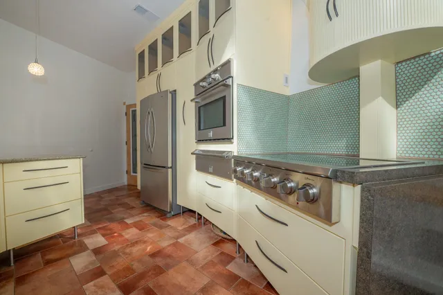 a bathroom with a double vanity sink mirror and shower