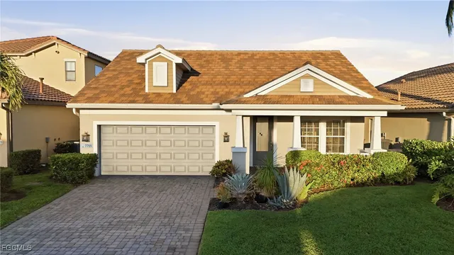 front view of a house with a garden