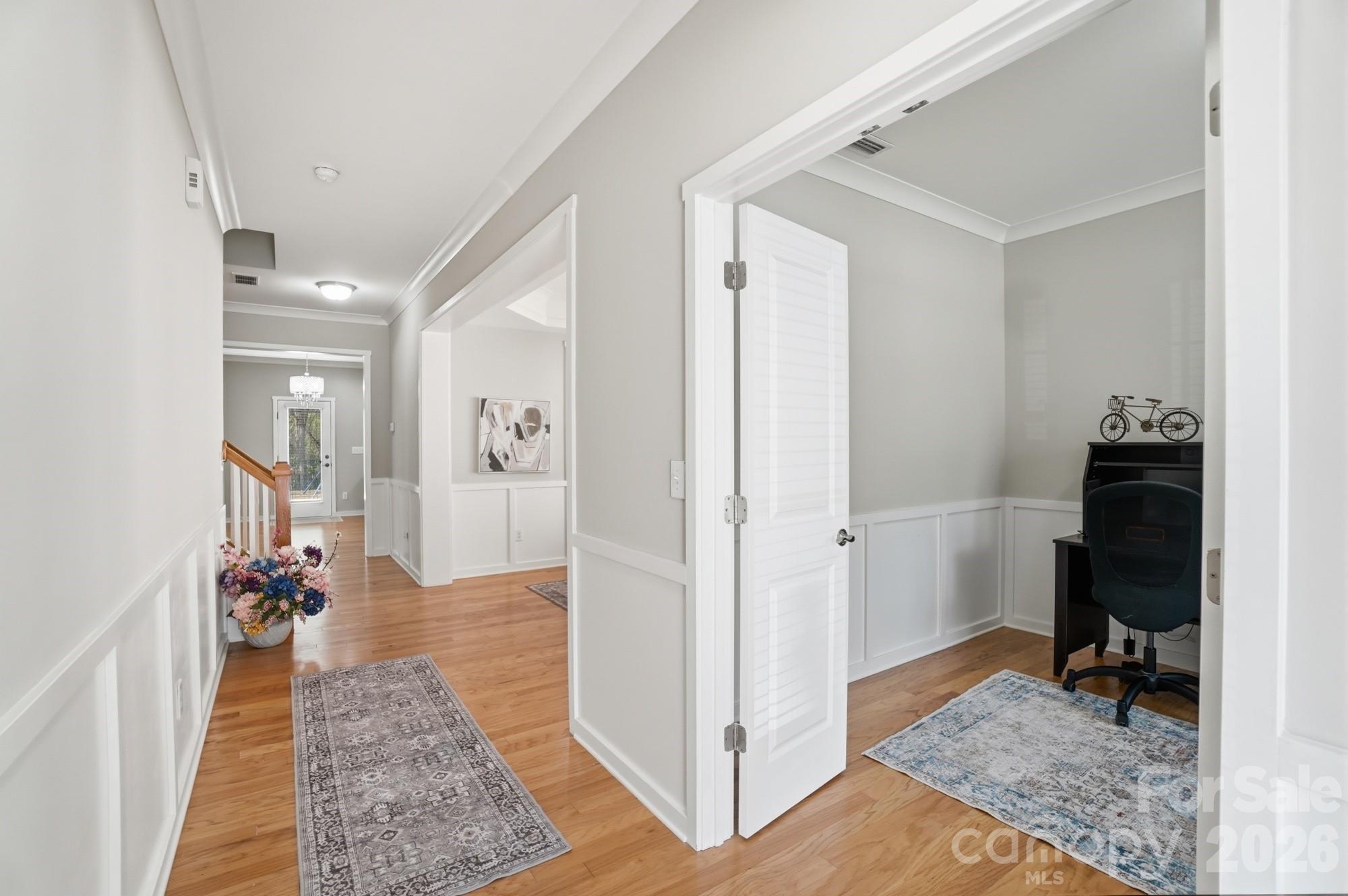 2153 Bluebell Way Tega Cay, SC 29708 - Photo 7 of 48 a view of a hallway and a livingroom with furniture