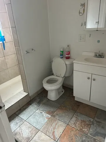 a bathroom with a toilet and a sink