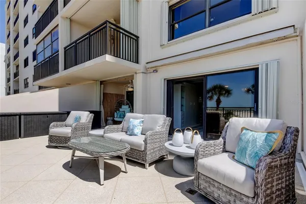 a outdoor living space with furniture and a fireplace