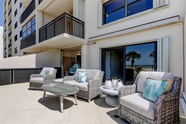 a outdoor living space with furniture and a fireplace