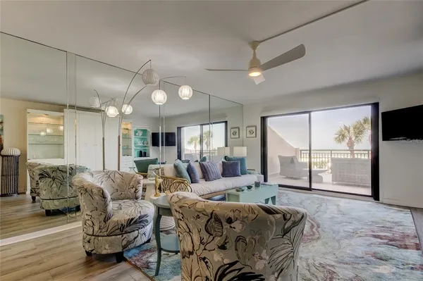 a living room with furniture and a large window