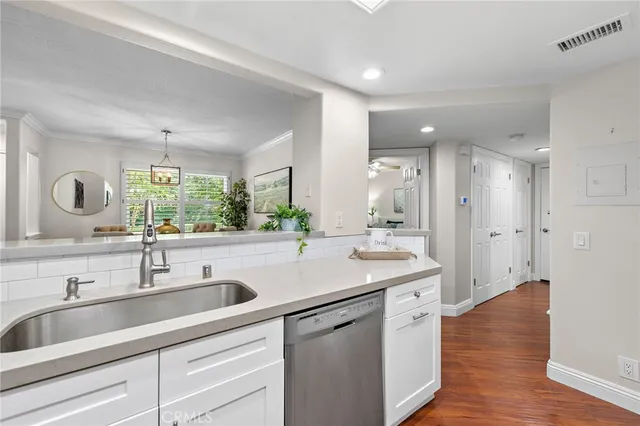 a bathroom with a sink and a large mirror