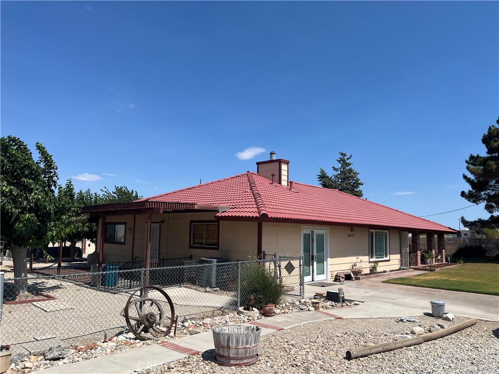 a front view of a house with sitting area