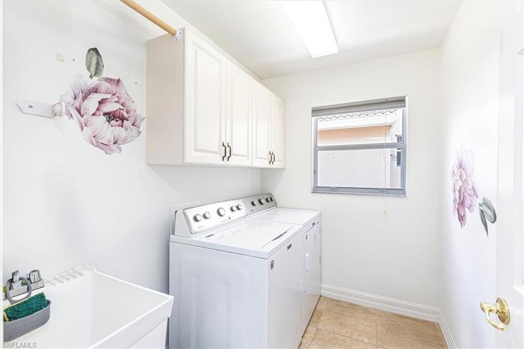 1630 Triangle Palm Terrace Naples, FL 34119 - Photo 18 of 24 a utility room with dryer and washer