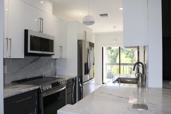 $5,860 | 11311 Pond View Drive, Unit C203, Wellington, FL 33414