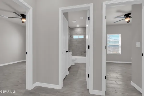 a bathroom with a glass shower door