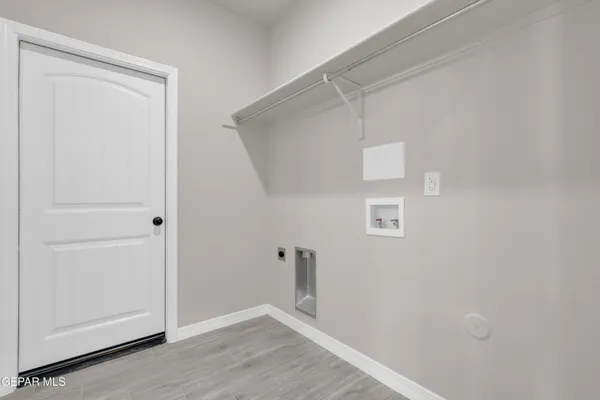 a kitchen with appliances a sink and cabinets