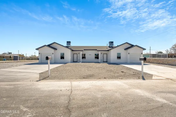 a view of a house with a backyard of house