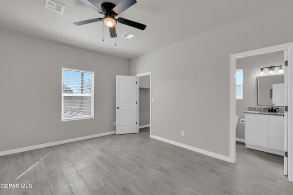 a view of a sink and a chandelier fan