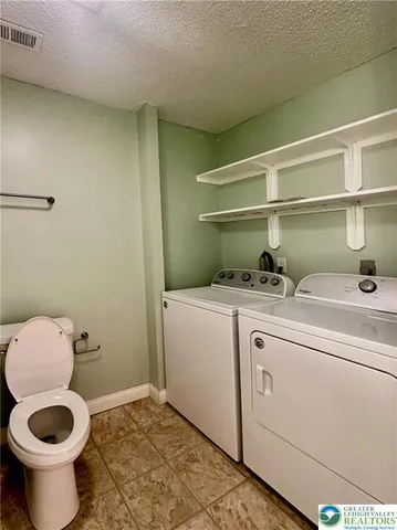 a bathroom with a shower and a bath tub