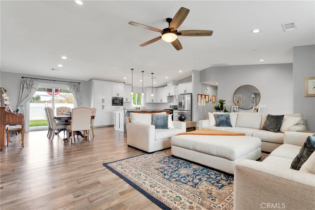 13968 Chogan Road Apple Valley, CA 92307 - Photo 13 of 35 a living room with furniture and kitchen view