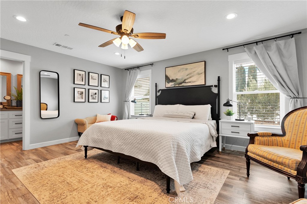 13968 Chogan Road Apple Valley, CA 92307 - Photo 15 of 35 a bedroom with a bed and a couch