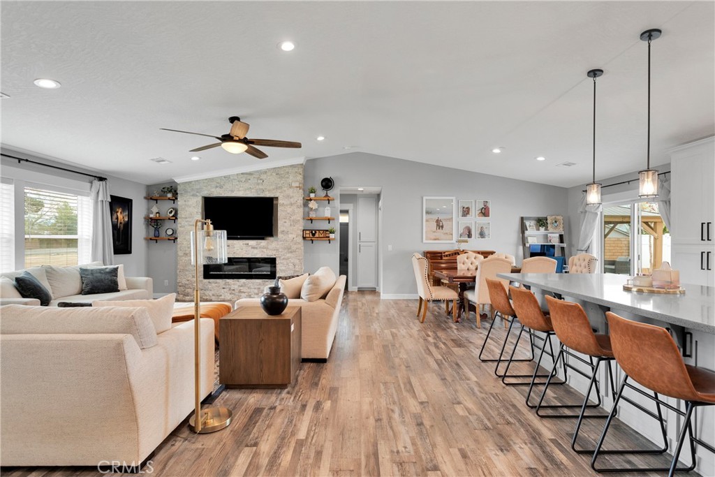 13968 Chogan Road Apple Valley, CA 92307 - Photo 5 of 35 a living room with furniture and a flat screen tv
