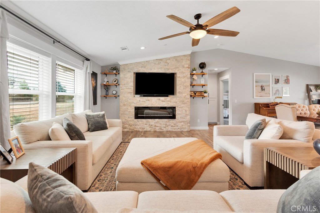 13968 Chogan Road Apple Valley, CA 92307 - Photo 6 of 35 a living room with furniture and a flat screen tv