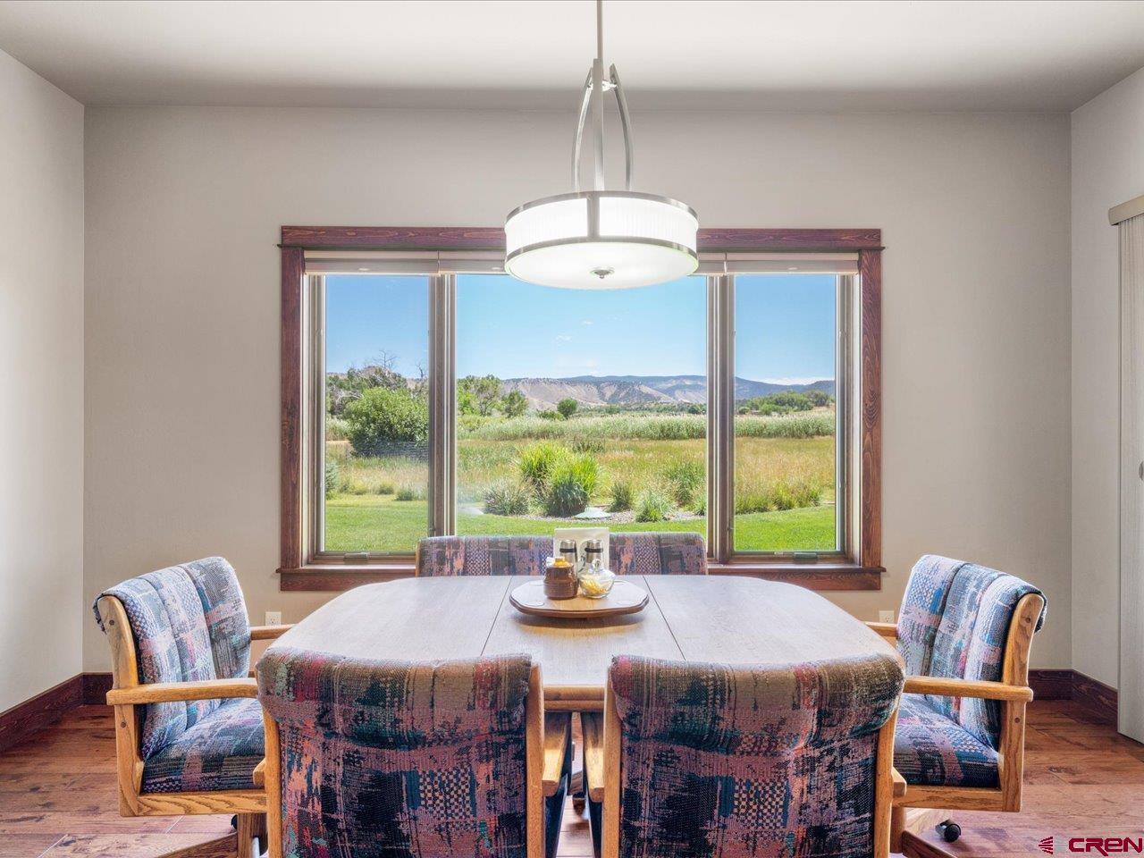 20784 6840th Road Montrose, CO 81403 - Photo 14 of 35 a view of a dining room with furniture window and outside view
