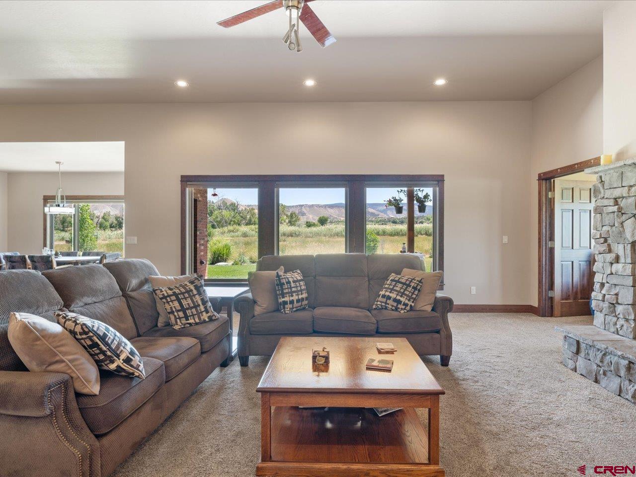 20784 6840th Road Montrose, CO 81403 - Photo 15 of 35 a living room with furniture and a large window