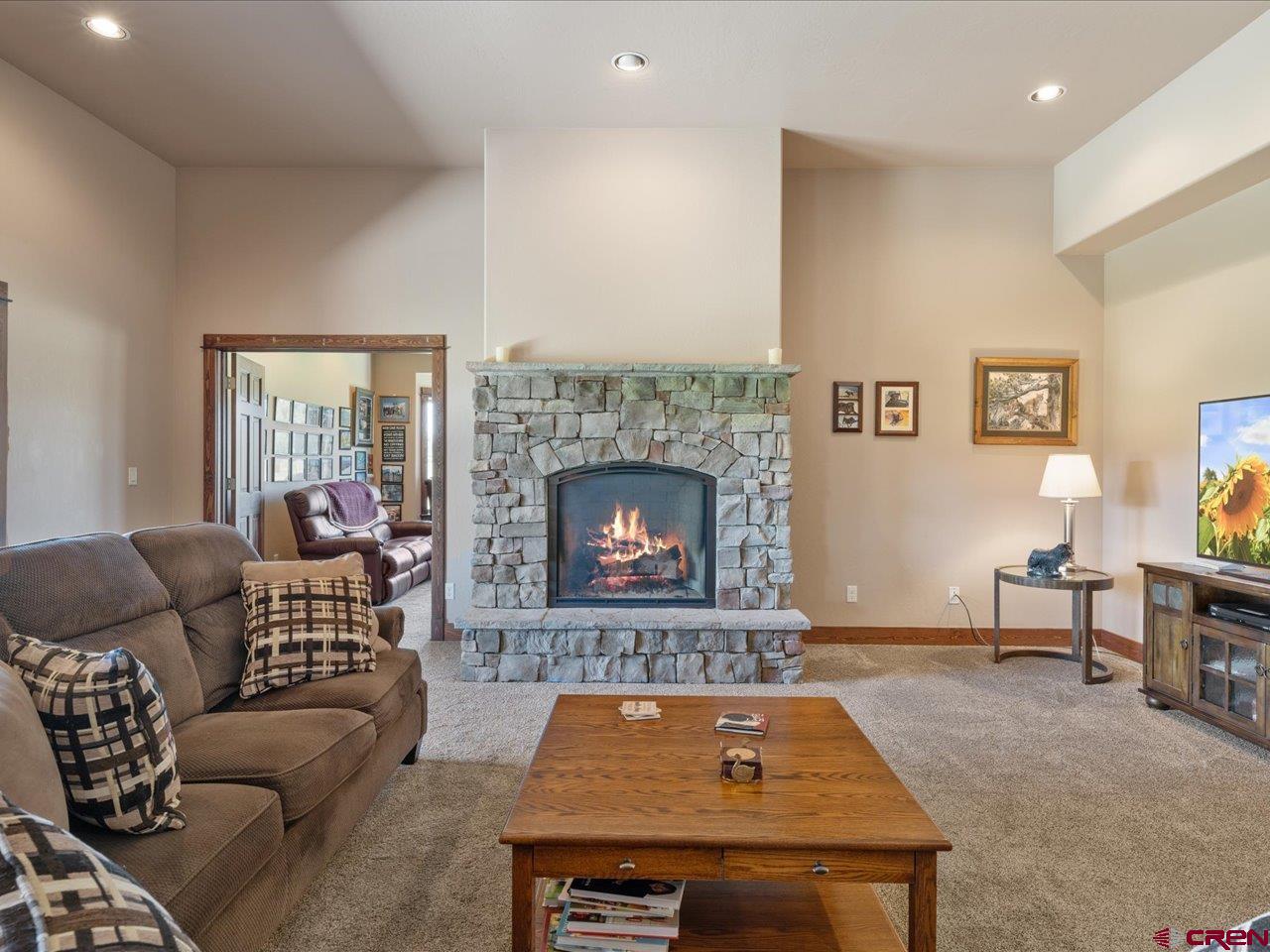 20784 6840th Road Montrose, CO 81403 - Photo 16 of 35 a living room with furniture and a fireplace