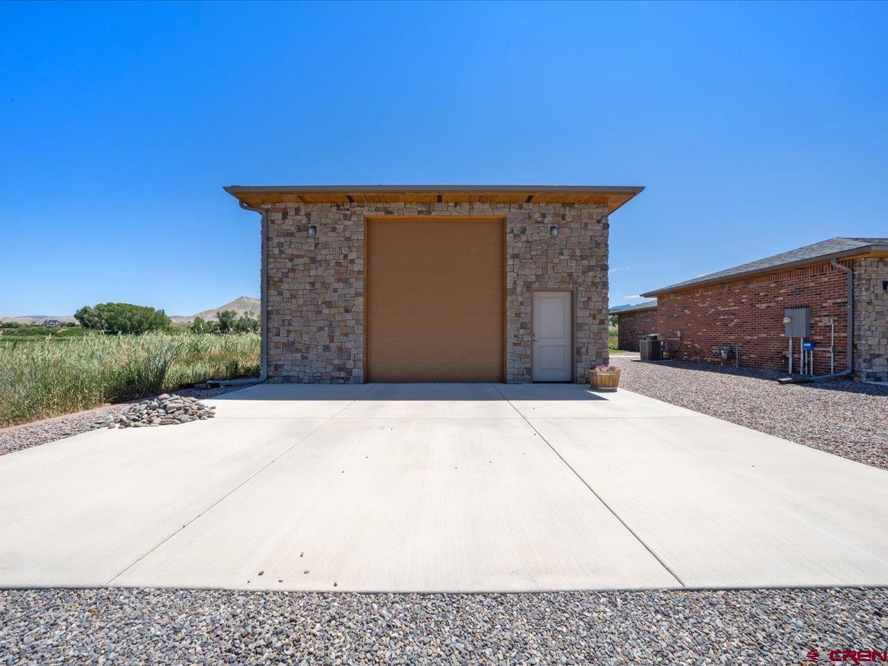 20784 6840th Road Montrose, CO 81403 - Photo 2 of 35 a front view of a house with a yard
