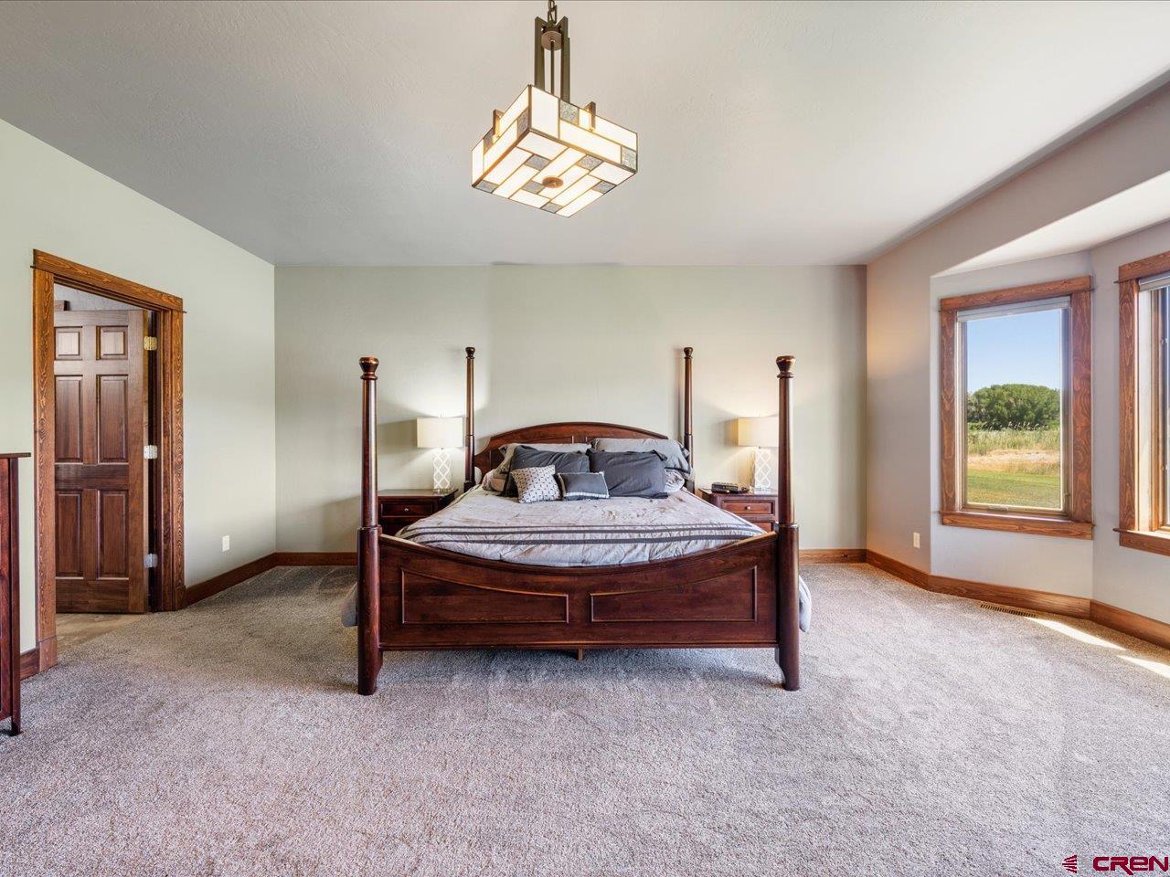 20784 6840th Road Montrose, CO 81403 - Photo 21 of 35 a bedroom with a bed and window