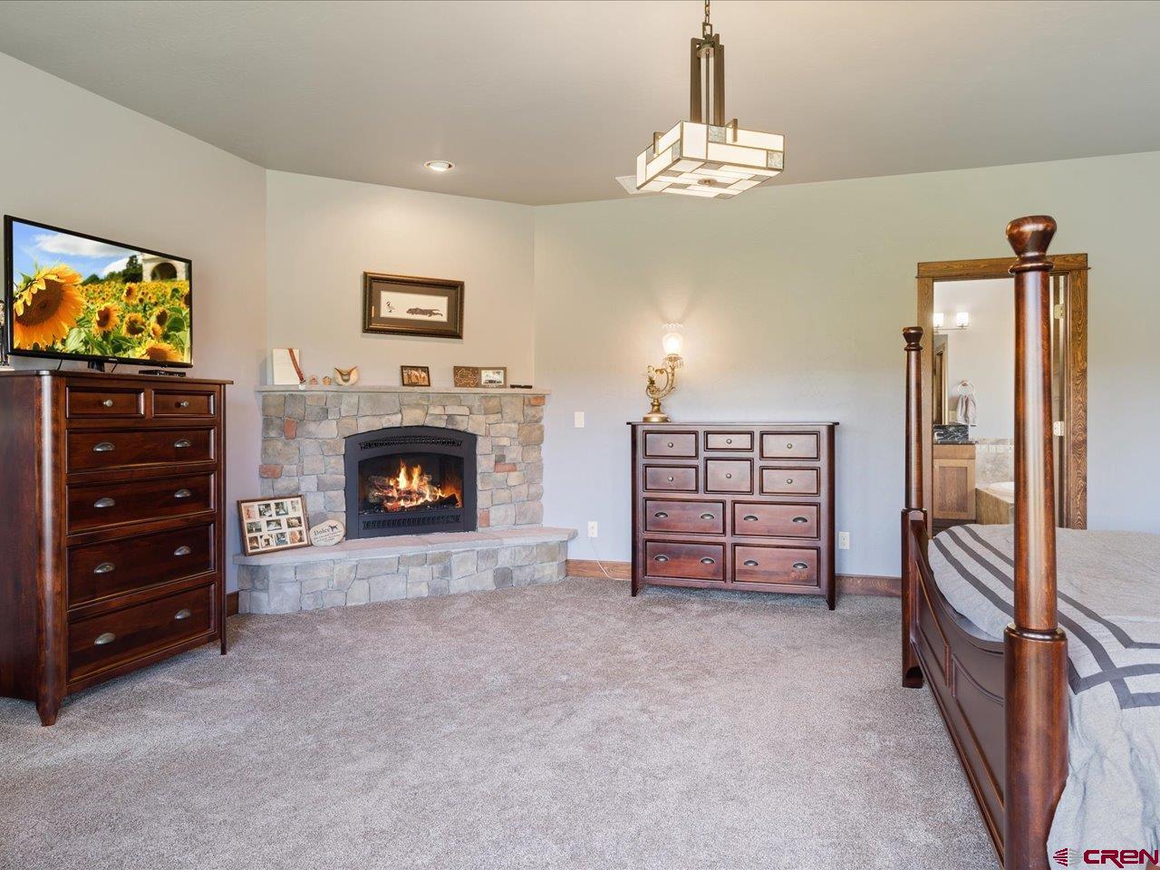 20784 6840th Road Montrose, CO 81403 - Photo 23 of 35 a view of a livingroom with a furniture cabinet and a flat screen tv