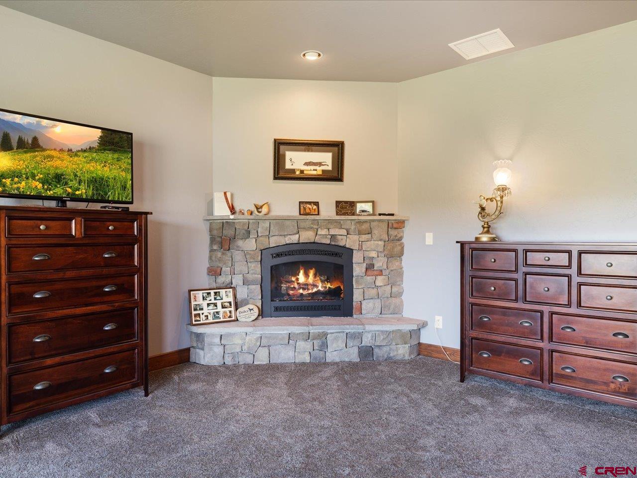 20784 6840th Road Montrose, CO 81403 - Photo 24 of 35 a living room with furniture and a fireplace