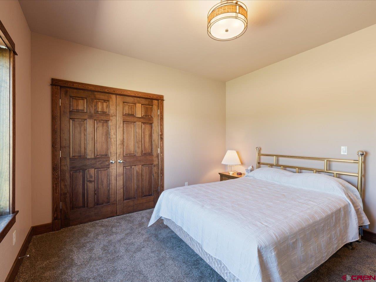 20784 6840th Road Montrose, CO 81403 - Photo 29 of 35 a bedroom with a bed and a window