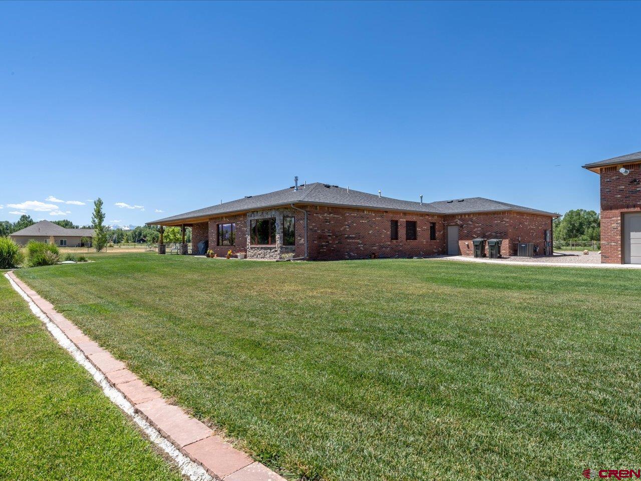 20784 6840th Road Montrose, CO 81403 - Photo 3 of 35 a front view of a house with garden