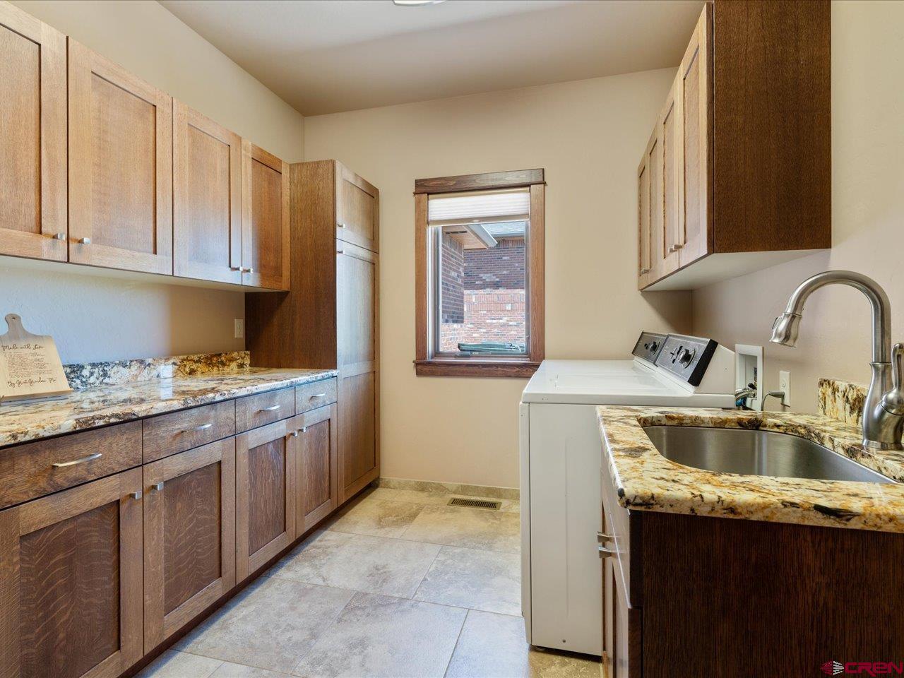 20784 6840th Road Montrose, CO 81403 - Photo 31 of 35 a kitchen with a sink stove and cabinets
