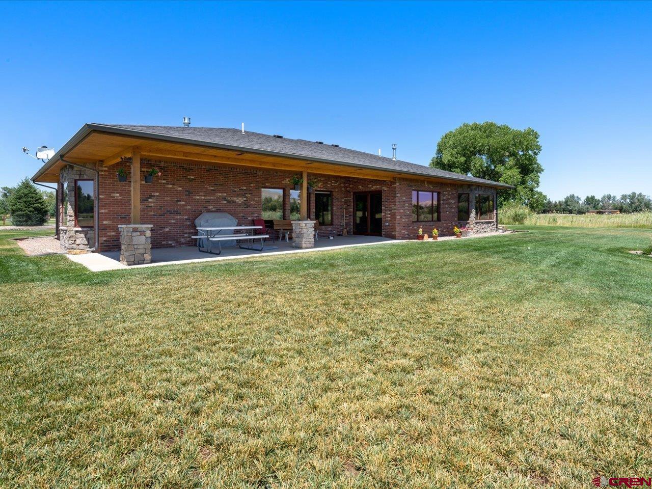 20784 6840th Road Montrose, CO 81403 - Photo 32 of 35 a view of a house with a yard