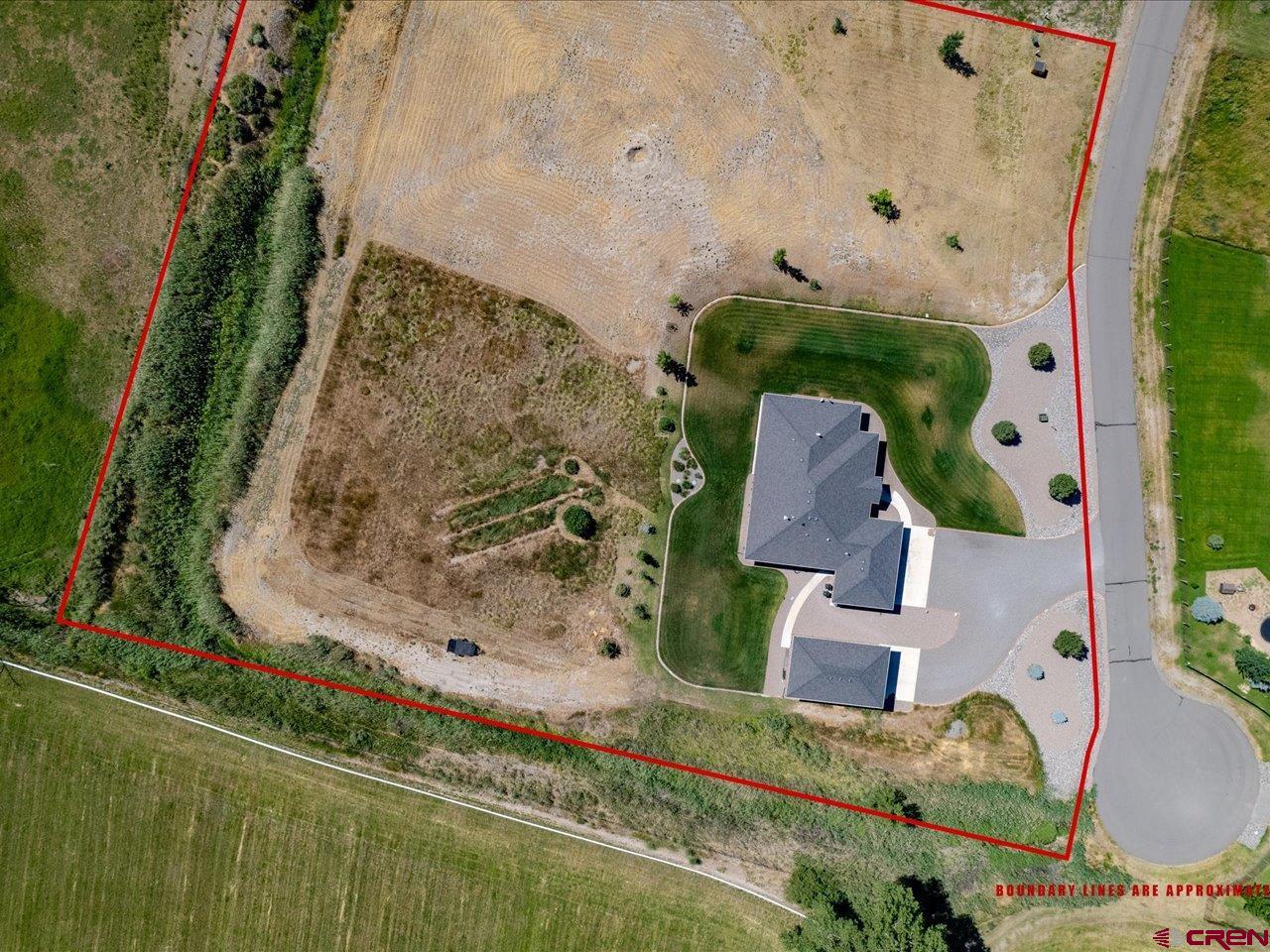 20784 6840th Road Montrose, CO 81403 - Photo 33 of 35 an aerial view of a house with a yard
