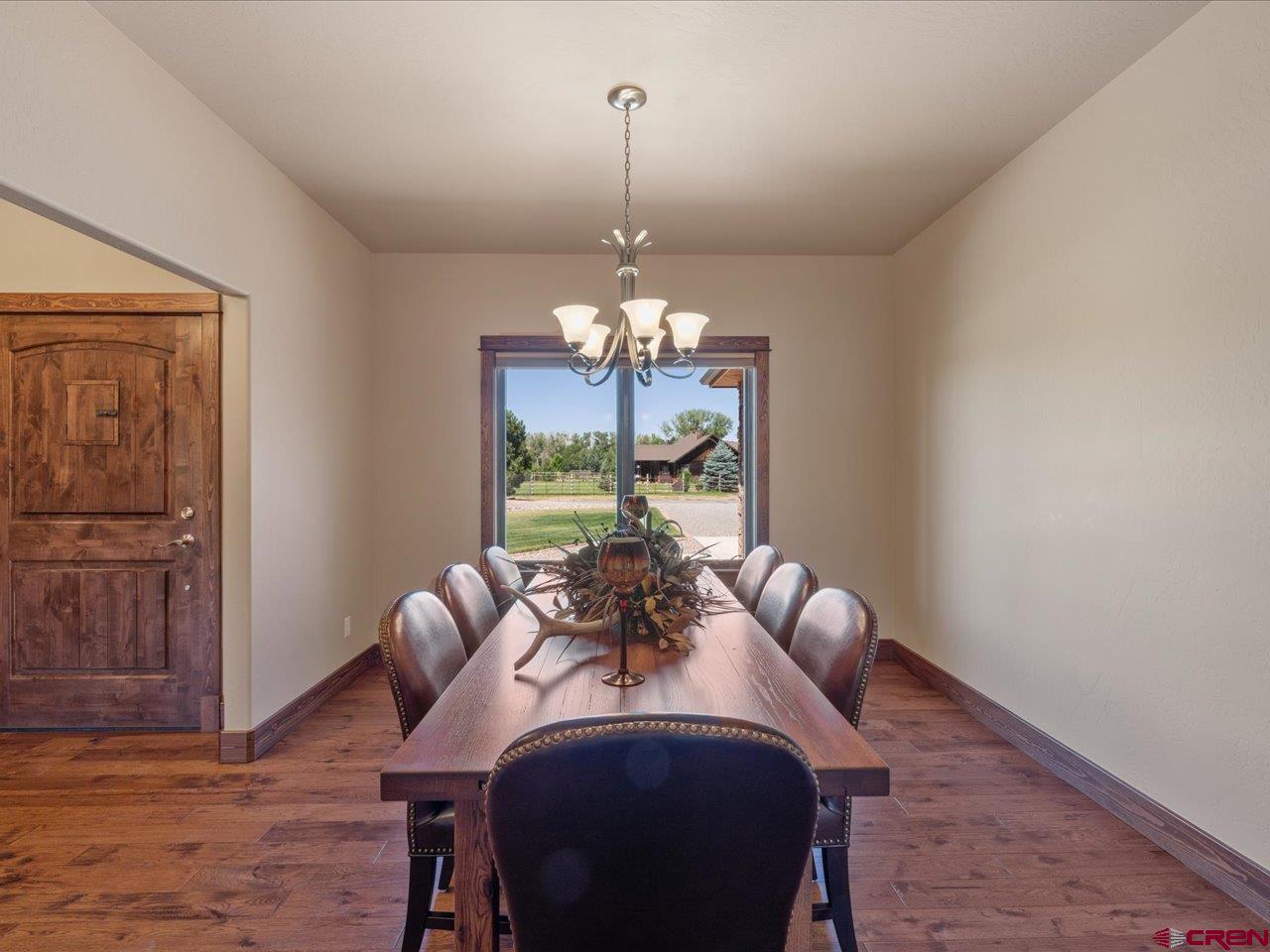 20784 6840th Road Montrose, CO 81403 - Photo 7 of 35 a view of a dining room with furniture window and wooden floor