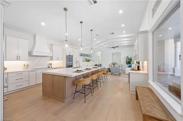 a bathroom with a double vanity sink mirror and double