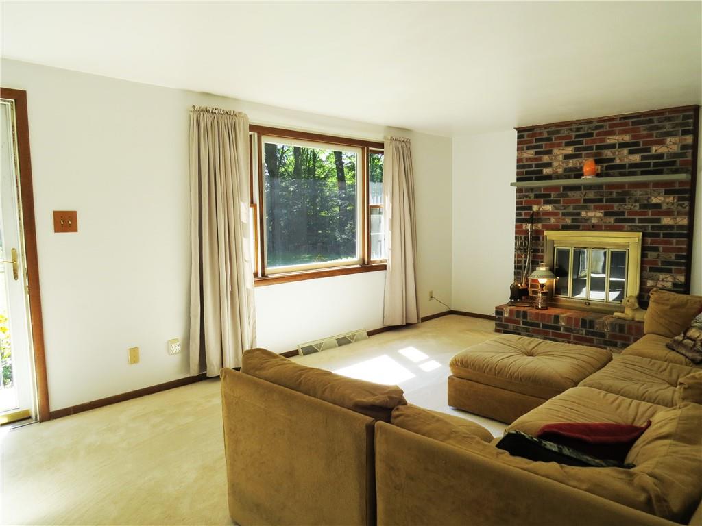 2056 Prospect Road Prospect, PA 16052 - Photo 3 of 25 a living room with furniture and a fireplace