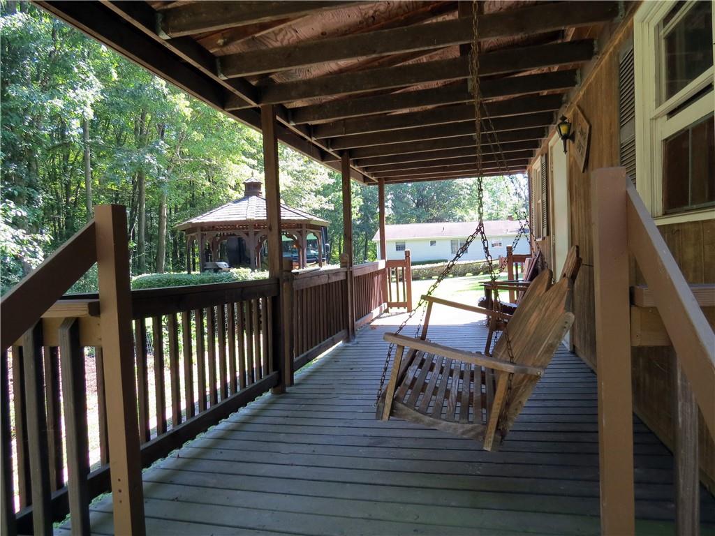 2056 Prospect Road Prospect, PA 16052 - Photo 8 of 25 a view of a porch with wooden floor outdoor seating
