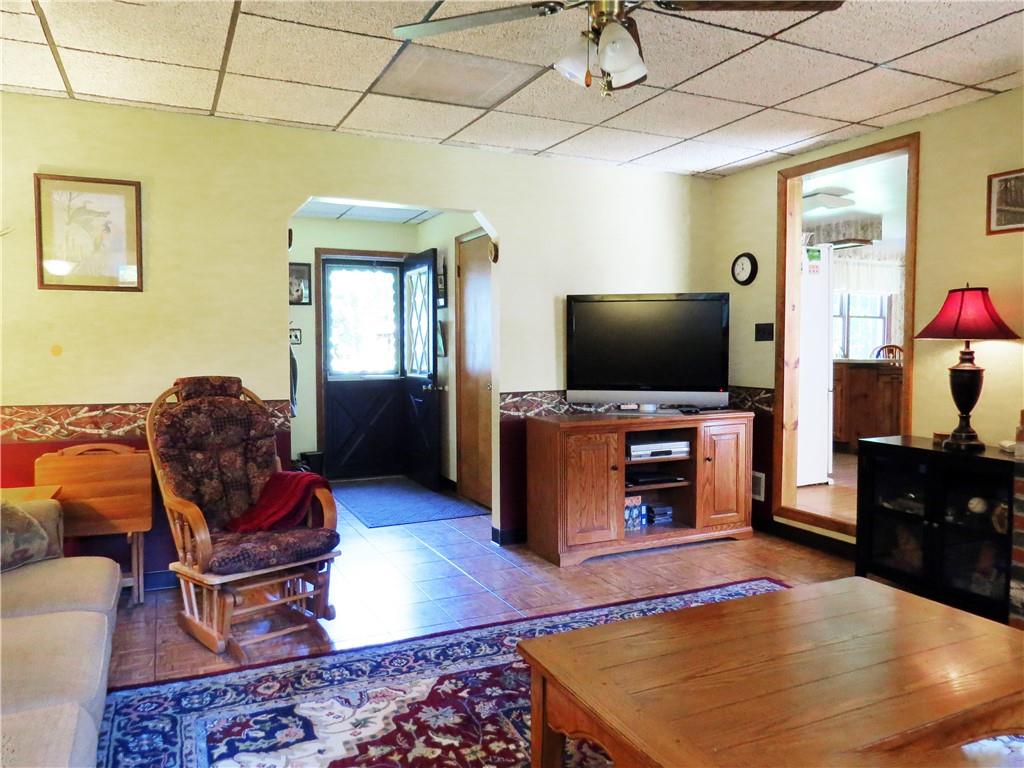 2056 Prospect Road Prospect, PA 16052 - Photo 10 of 25 a living room with furniture and a flat screen tv