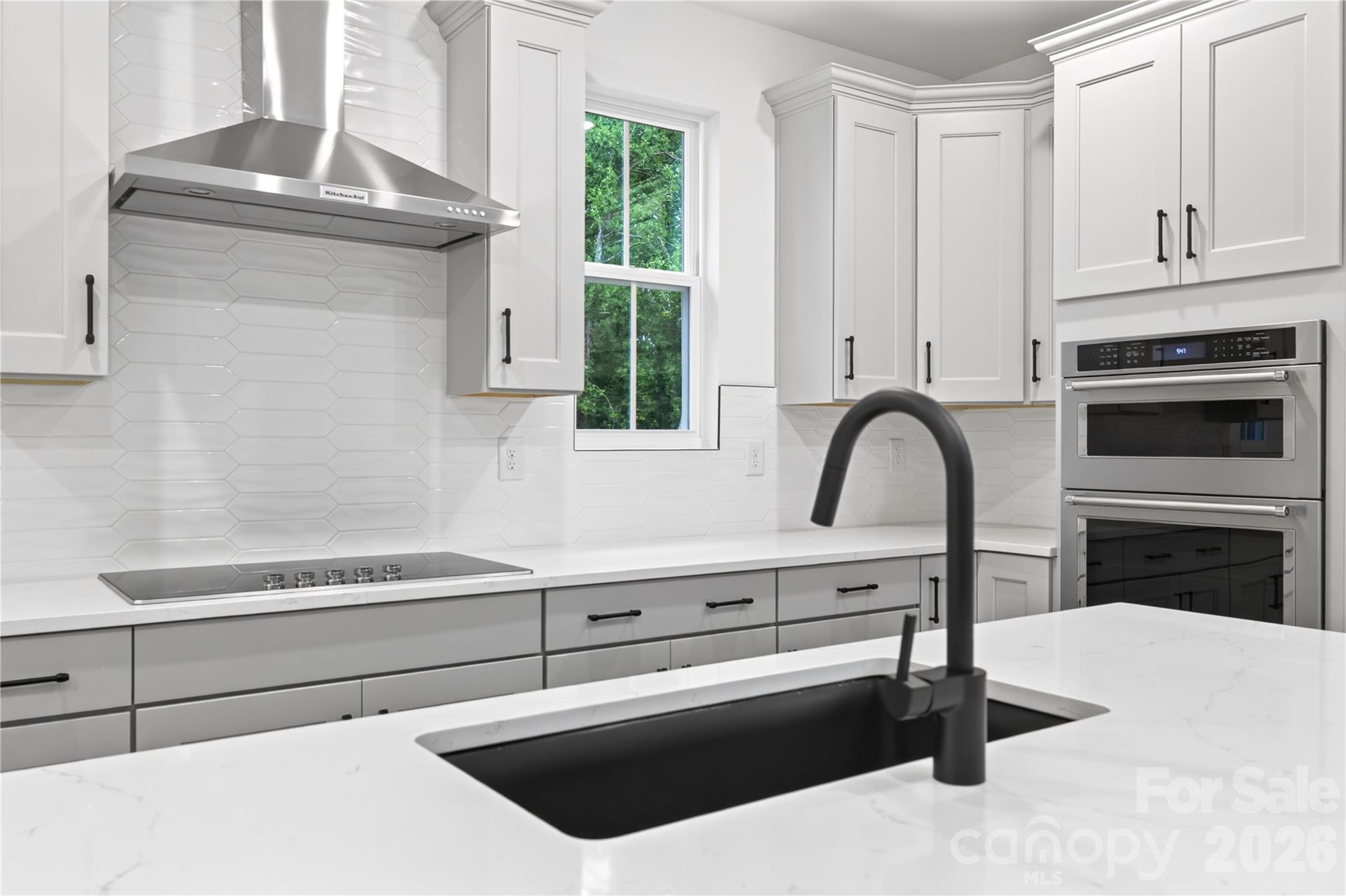 416 Celestial Drive Tega Cay, SC 29708 - Photo 6 of 21 a kitchen with a sink and a stove top oven