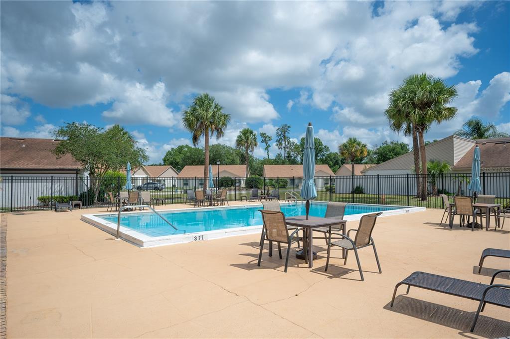 4231 Oak Loop, Unit 51 Mulberry, FL 33860 - Photo 27 of 29 a view of a patio with swimming pool