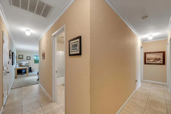 a living room with furniture a window and a ceiling fan
