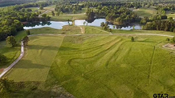 a view of a lake with a yard