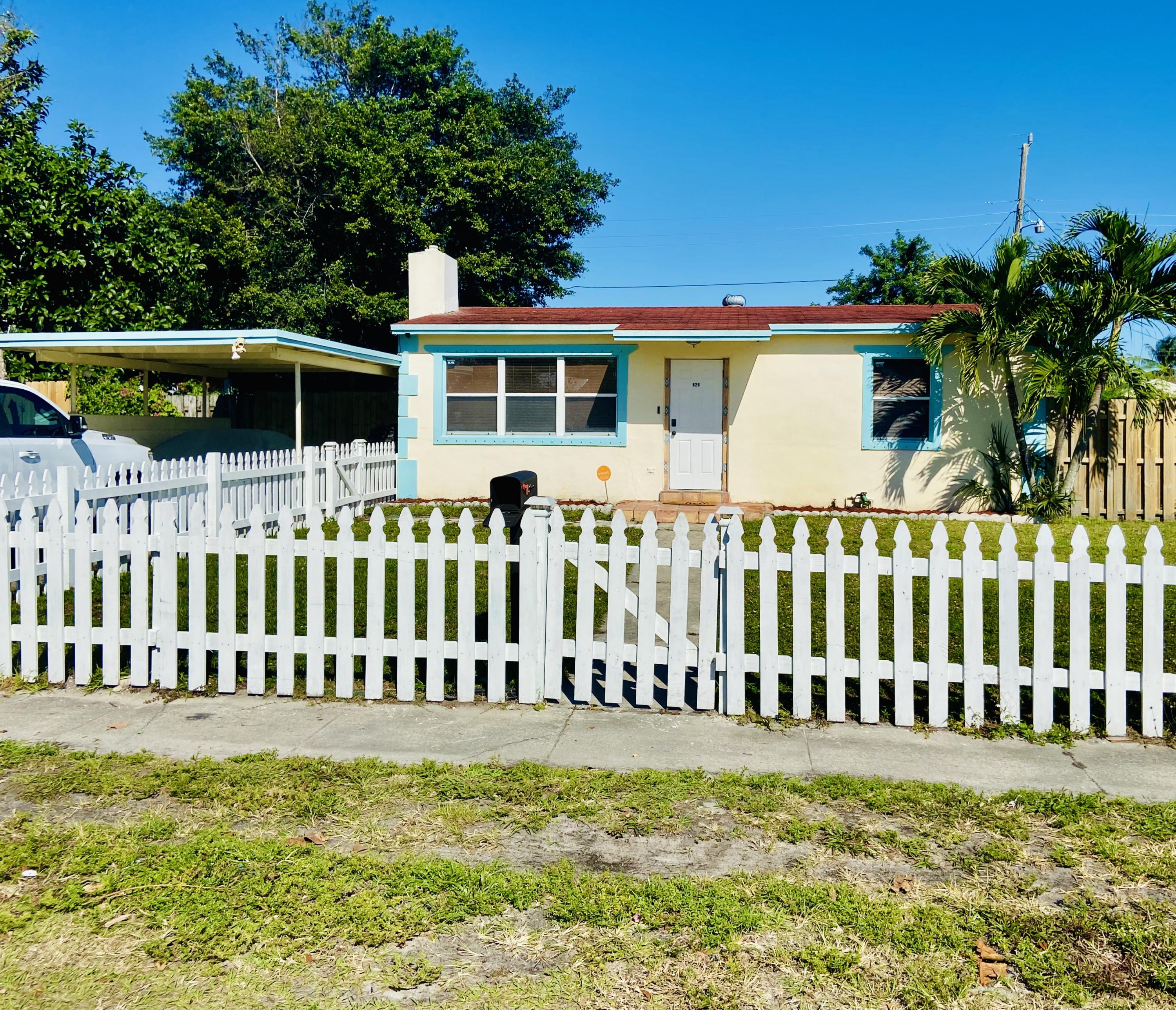 829 Cherry Road West Palm Beach, FL 33409 - Photo 1 of 18 Front of home